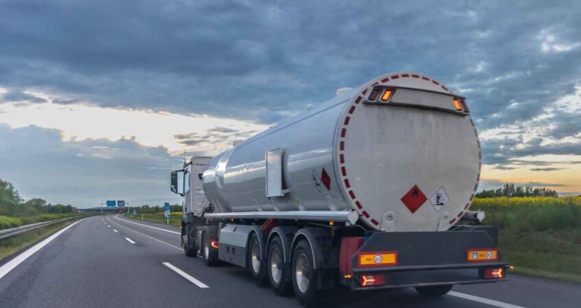 Modern fuel transportation tanker using GPS tracking and smart fleet technology for safe fuel delivery.